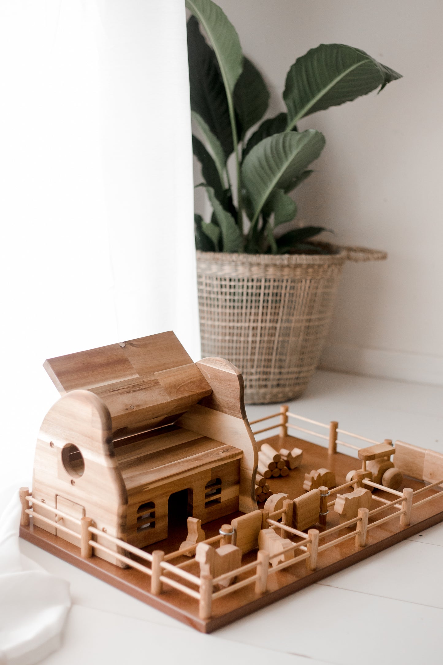 Sturdy wooden Farm Barn playset for kids, perfect for imaginative rural adventures and housing toy animals.